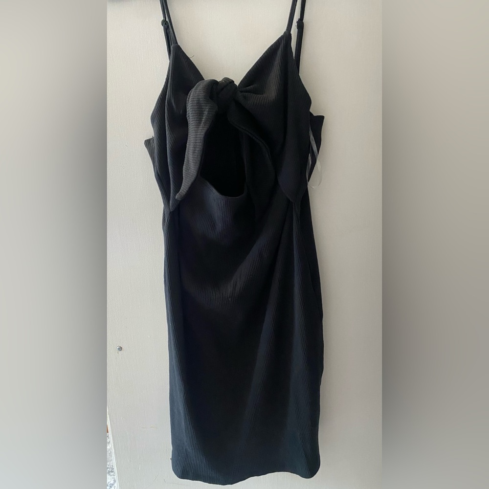 Black bodycon dress with tie in the front.